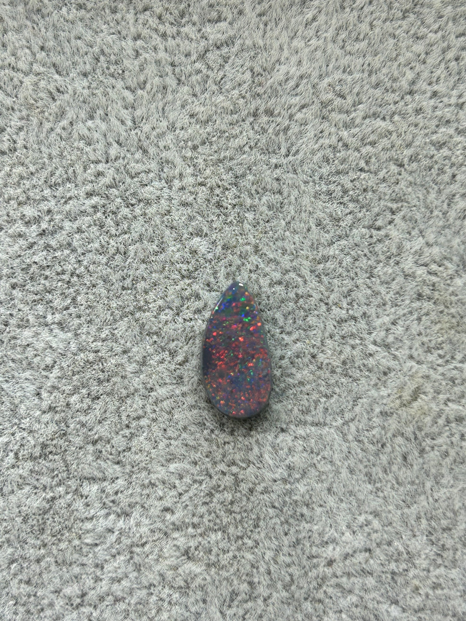 Red pin-fire opal
