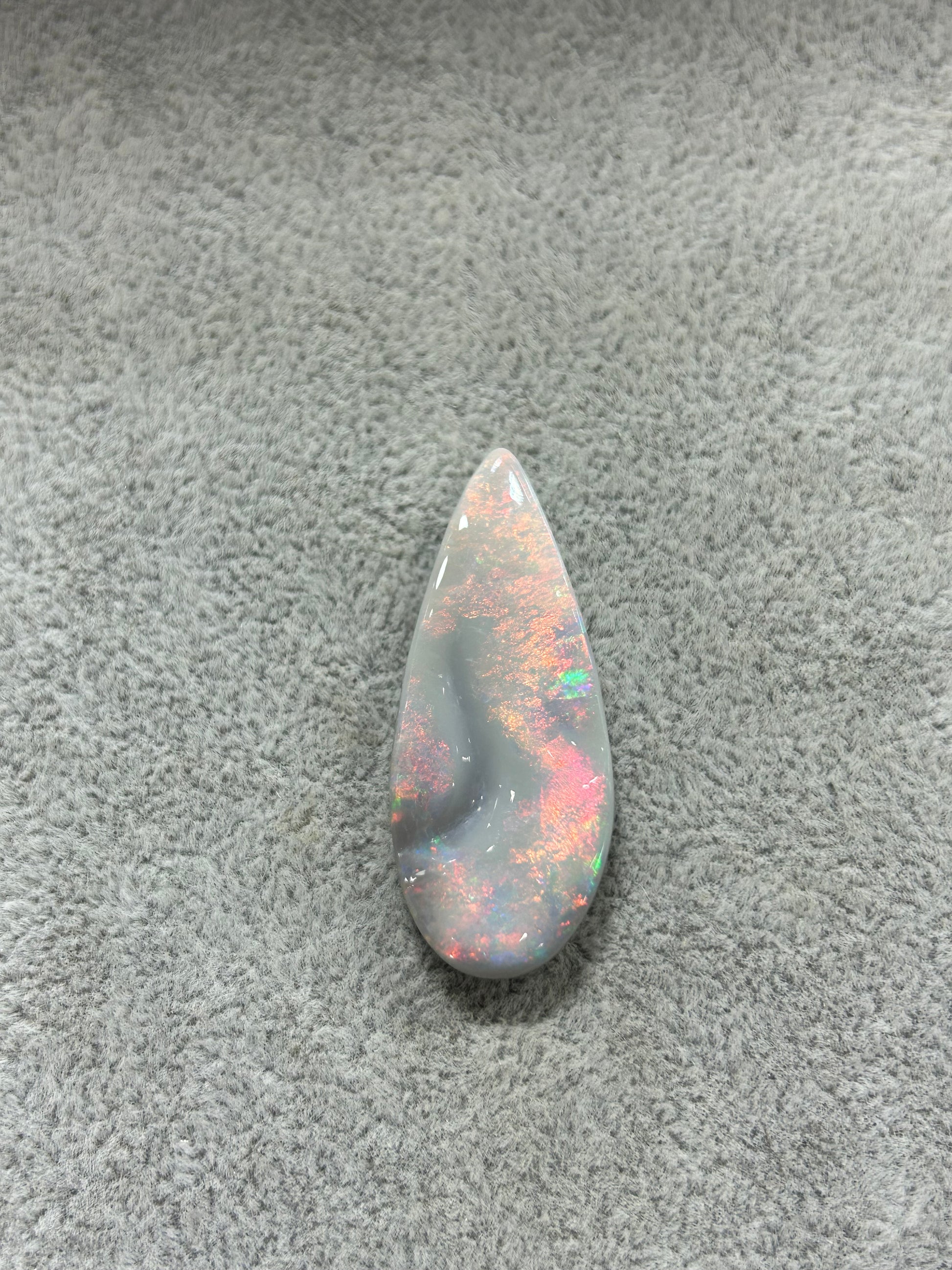 Carved tear drop black opal