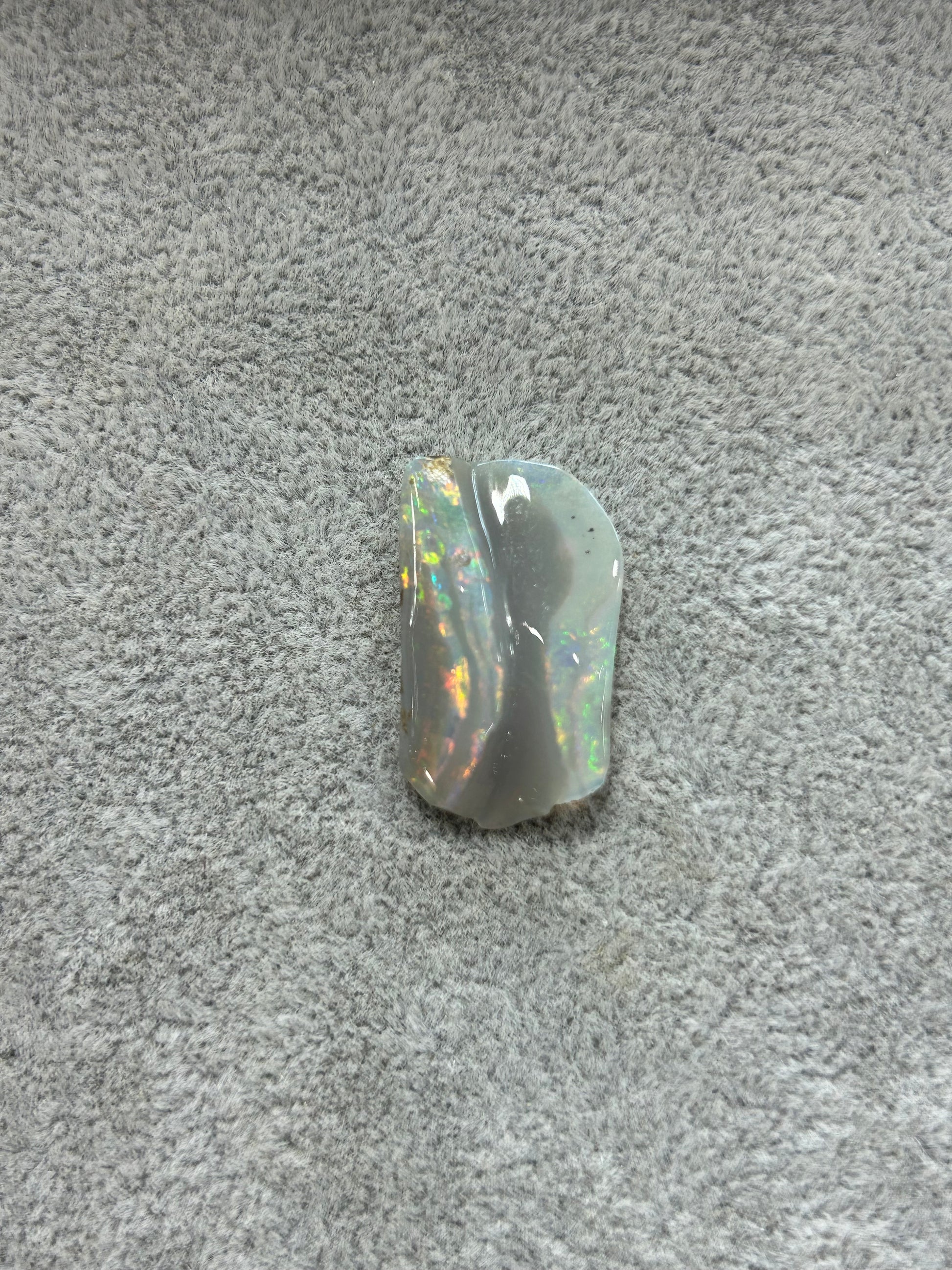 Black opal with ribbons of color